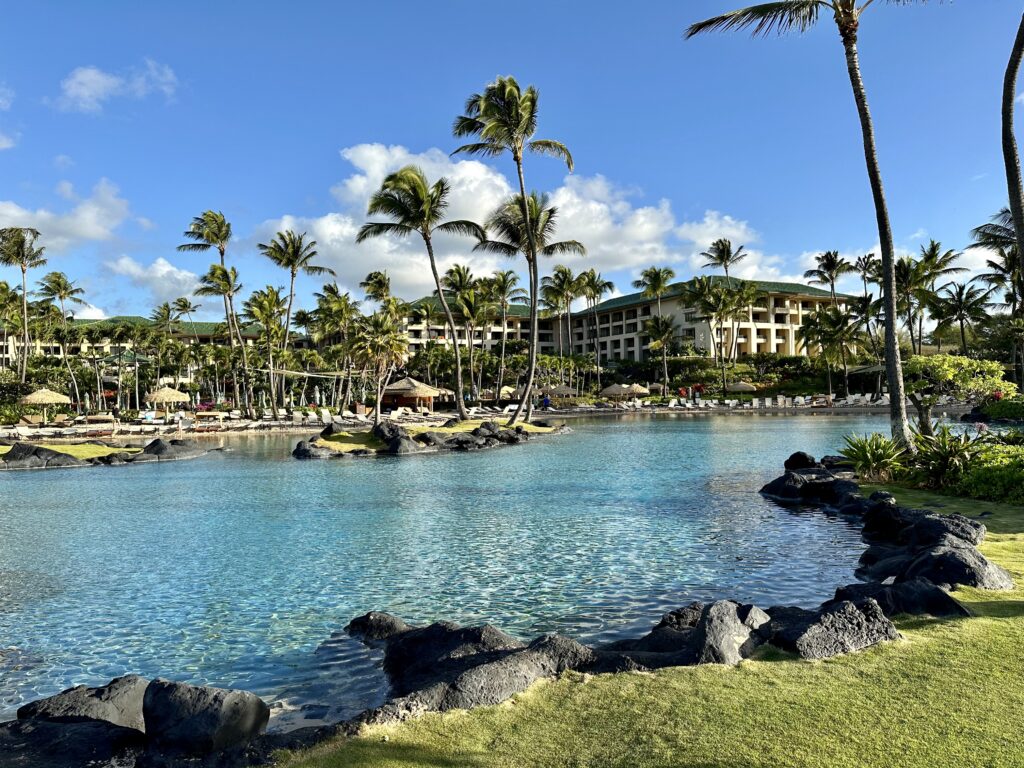 The view of the Grand Hyatt Kauai in the background of the saltwater lagoon on the property